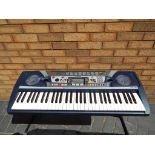 A Yamaha PSR-282 electronic keyboard with stand and carry case This lot MUST be paid for and