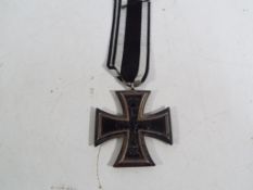 A German Iron Cross marked 1914, Second Class.