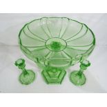 A Uranium glass centre piece with matching candle sticks,