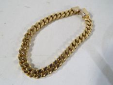 A yellow metal bracelet stamped .750 (indicating 18 carat gold) approx 18 cm, 33.