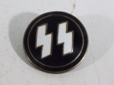 A German enamelled badge marked with SS emblem.