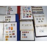 Philately - seven folders containing a quantity of UK and foreign stamps and one folder containing