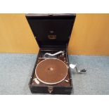 An HMV portable wind-up gramophone in case.
