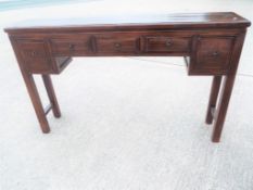 A good quality fruitwood four drawer side table 92 cm x 146 cm x 28 cm