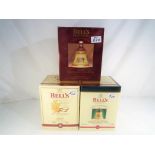 Bells Old Scotch Whisky - three Christmas decanters containing 8 year old extra special Old Scotch