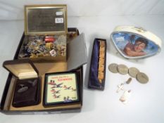 A good mixed lot to include a Queen Elizabeth commemorative tin containing a quantity of paired