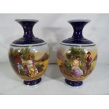 A pair of Royal Vienna style ceramic vas