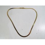 A yellow metal necklace stamped .750 (in