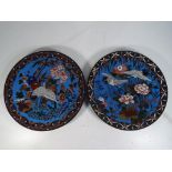 Two Japanese cloisonne plates decorated
