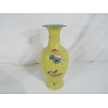 A Chinese yellow Sgraffito vase Qing dynasty with character marks, approximate height 25 cm.