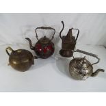A small collection of four teapots.