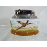 Minton - A Minton ceramic cased Ronson table lighter depicting a pheasant in flight,