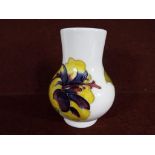 Moorcroft Pottery - A Moorcroft pottery vase of globular form decorated with hibiscus on a cream