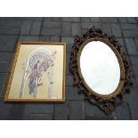A decoratively framed wall mirror and a glazed print depicting a lady and butterflies,