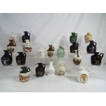 A collection of twenty miniature / taster bottle of Scotch Whisky in ceramic decanters