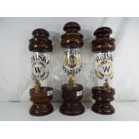 Breweriana - three glass and wood whisky dispensers, largest 40 cm (h) (3).
