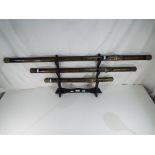 Three ornamental Japanese style swords,
