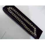 A heavy silver curb chain necklace This