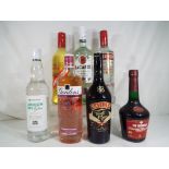 Seven bottles of alcoholic beverages to include Gordons Premium Pink Gin, Warninks, Bacardi,