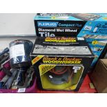 A lot to include a Plasplugs diamond wet wheel tile cutter boxed, a Black & Decker woodworker boxed,