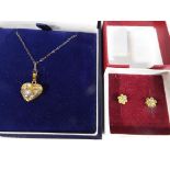 A pair of lady's 9ct yellow gold earrings in the form of a flower stone set and a fine 9ct gold