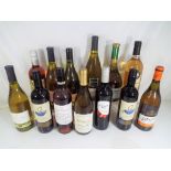 Thirteen various bottles of wine.