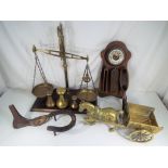 A large set of brass balance scales and weights,