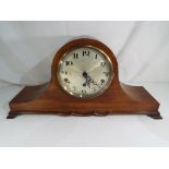 An early 20th century Edwardian mahogany Napoleon mantel clock with a Westminster chiming eight day