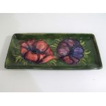 Moorcroft Pottery - A rectangular pen tray by Moorcroft pottery decorated with clematis on a green