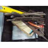 A box of tools to include files, drill bits,