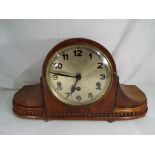 A mahogany cased mantel clock, Arabic numerals on a silvered dial, Westminster chimes,