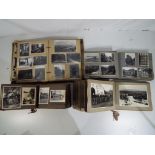 Four albums containing a quantity of black and white photographs to include Second World War period,