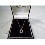 A lady's 9 carat gold chain and stone set pendant, approximate weight 3.57 grams, boxed.