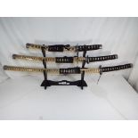 A set of three replica /ornamental Samurai swords by Accent Warrior,