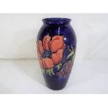 Moorcroft Pottery - A large Moorcroft pottery vase decorated with anemone on a blue ground,