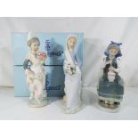 Lladro - three Lladro figurines to include #4972 Girl with Lilies, #1304 Valencian Girl,