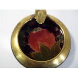 Moorcroft - a Moorcroft pomegranate ashtray brass ring, approximately 11.