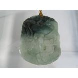 An Oriental ornate jade medallion