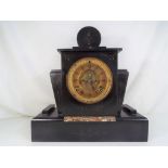 An Art Deco styled black marble mantel clock,