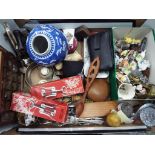 A mixed lot of collectables to include plated flatware, ceramic figurines, thimbles in display case,