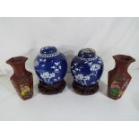 Two ginger jars on wooden stands (lids damaged) together with two Yixing type vases with impressed