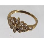 A lady's 9ct gold ring set with diamond chips, size P, approx weight 2.