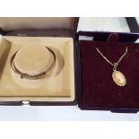 A lady's 9ct gold chain with yellow metal cameo pendant and a rolled gold Christening bracelet,
