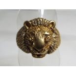 A gentleman's hallmarked 9ct gold ring in the form of a lion with stone set eyes and mane, size W½ ,