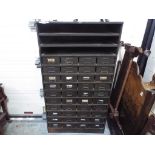 Roneo War Finish - a Roneo War Finish metal cabinet comprising forty drawers below three shelves