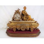 A 19th century French mantel clock with drum movement striking on a bell,