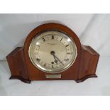 A mahogany cased mantel clock having Roman numerals on a silvered dial, Westminster chimes,