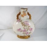 Royal Worcester - a Royal Worcester Moon Flask having twin handles hand painted floral decoration