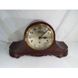 A mahogany cased mantel clock, Arabic numerals on a silvered dial, Westminster chimes,