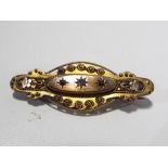A 9 carat gold hallmarked mourning brooch, stone set, approximate weight 3.52 grams.